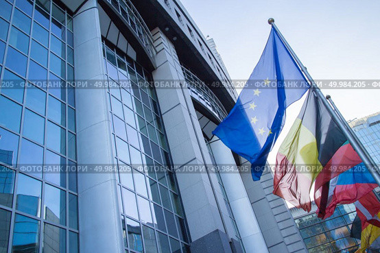 Flags with European Parliament in Brussels, Belgium. Flags with European Parliament. Стоковое фото, агентство Ingram Publishing / Фотобанк Лори
