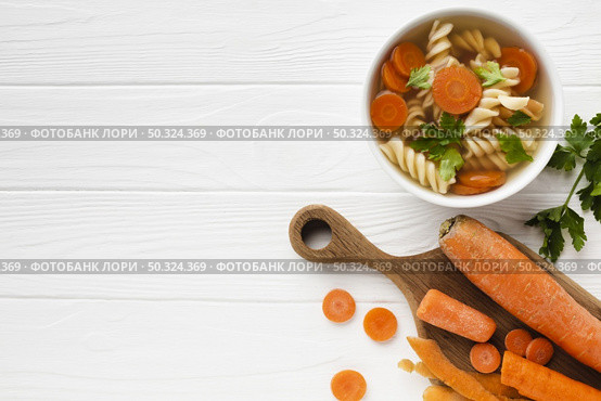 flat lay fusilli broccoli carrots bowl with copy space. Стоковое фото, агентство Ingram Publishing / Фотобанк Лори