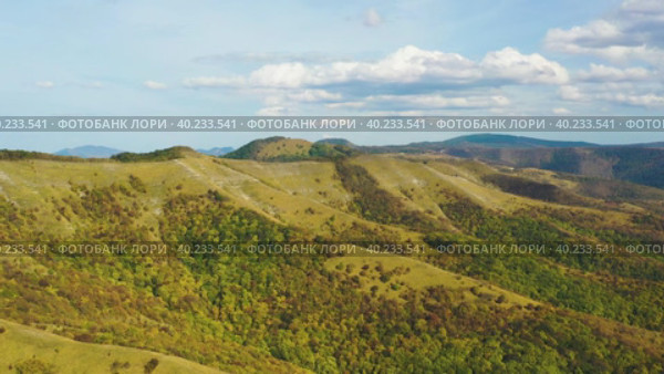 Flying Above Green And Yellow Mountains. Aerial View. Стоковое видео, видеограф Кирилл Трифонов / Фотобанк Лори