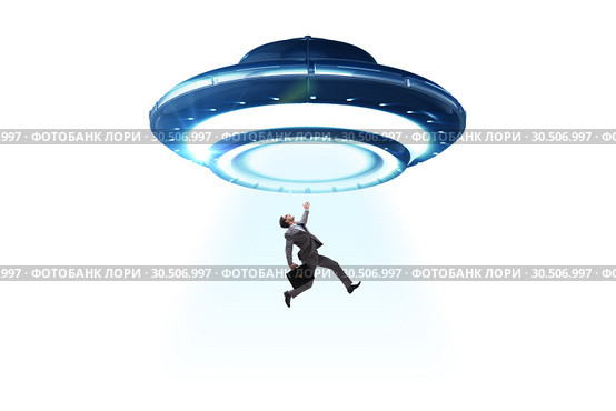 Flying saucer abducting young businessman. Стоковое фото, фотограф Elnur / Фотобанк Лори