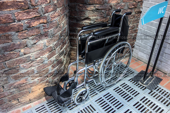 Folded wheelchair. Public toilet. Стоковое фото, фотограф Iva Noel / Фотобанк Лори