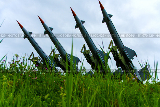 Four S-125 SAM missiles lined up in a row on a field covered with grass. Belarus. Stalin's Line Park. 10.08.25. Редакционное фото, фотограф Ярославский Максим / Фотобанк Лори