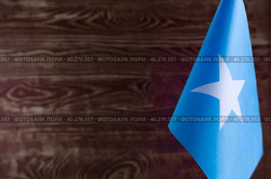 Фрагмент флага Республики Сомали на цветном деревянном фоне место для текста (2019 год). Стоковое фото, фотограф Лозовая Людмила / Фотобанк Лори