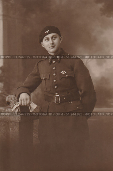 FRANCE - CIRCA 1914s-1920s : Vintage photo with French soldier in uniform in studio. Редакционное фото, фотограф Irina Kuchugurina/Gaudy / Фотобанк Лори