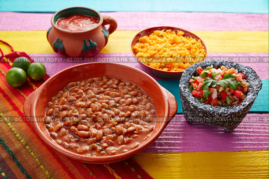 Frijoles mexican beans with rice and sauces nopal and pico de gallo. Стоковое фото, агентство Ingram Publishing / Фотобанк Лори