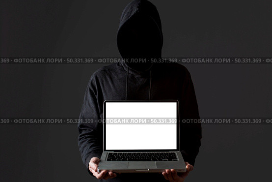 front view male hacker holding laptop. High resolution photo. front view male hacker holding laptop. High quality photo. Стоковое фото, агентство Ingram Publishing / Фотобанк Лори