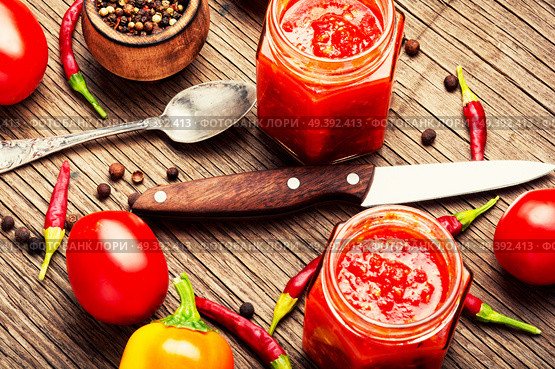 Georgian homemade sauce adjika with pepper, garlic and tomatoes.Barbeque sauce. Spicy seasoning, adjika sauce. Стоковое фото, агентство Ingram Publishing / Фотобанк Лори