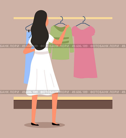 Girl chooses clothes on the hanger on shopping. Female buyer is selecting clothes in a store. Young beautiful fashion girl is standing near the stand with clothes. Shopper during the sale in a shop. Girl chooses clothes on the hanger on shopping. Female buyer is selecting clothes in a store. Стоковая иллюстрация, агентство Ingram Publishing / Фотобанк Лори