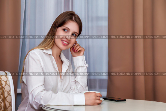 Girl Contemplating Future Plans Over Morning Coffee in Bright Apartment. Стоковое фото, фотограф Aleksandr Golubev / Фотобанк Лори