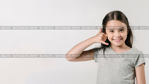 girl showing call sign studio. Стоковое фото, агентство Ingram Publishing / Фотобанк Лори