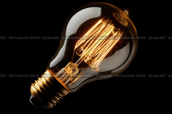 Glowing Yellow Light Bulb. Illuminated Light bulb on dark black background banner. Creative Technology. Vintage Edison Bulbs. Warm Illumination in a night space. New idea, brainstorming concept. Стоковое AI-изображение, AI-художник Марина Демидюк / Фотобанк Лори