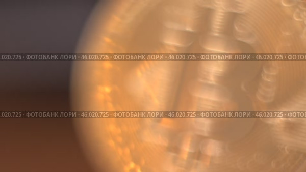Gold Bitcoin Symbol beautifully placed on a Wooden Surface. Close up. Стоковое видео, видеограф Степанов Григорий / Фотобанк Лори