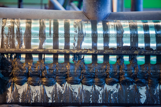 Gold ore processing. Concentrating plant. Wet magnetic drum separator close-up. Khromtau, Aktobe region, Kazakhstan, Mechel company. Стоковое фото, фотограф Alexey Rezvykh / Фотобанк Лори