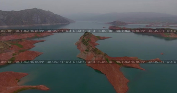 Город Нурек, плотина, водохранилище. Вид с дрона. Таджикистан (2016 год). Стоковое видео, видеограф Евгений Ковалев / Фотобанк Лори