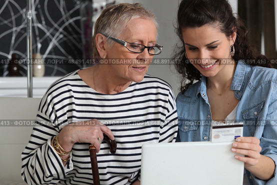 grandma and home helper with laptop. Стоковое фото, агентство Ingram Publishing / Фотобанк Лори