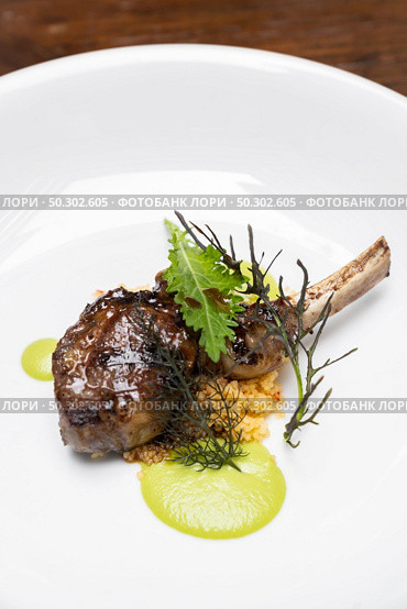 Grilled lamb chop with pesto sauce, international gourmet cuisine a la carte in buffet live station. Using for food and drink industry.. Grilled lamb chop. Стоковое фото, агентство Ingram Publishing / Фотобанк Лори
