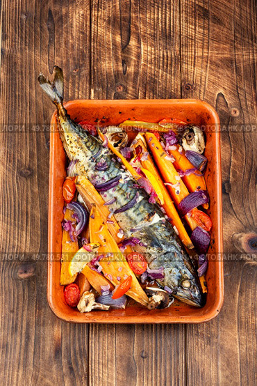 Grilled mackerel fish with sweet potato, herbs and spices. Georgian cuisine. Rustic style.. Cooked mackerel fish. Стоковое фото, агентство Ingram Publishing / Фотобанк Лори
