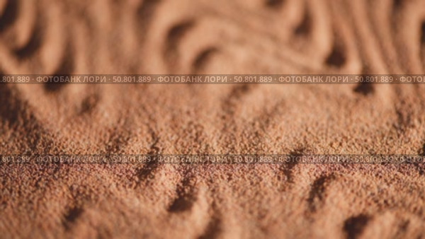 Ground chicory root forms a wavy pattern to create an interesting texture, the powder of a popular decaffeinated coffee substitute, chicory powder falls from top to bottom. Стоковое видео, видеограф Ольга Ильина / Фотобанк Лори
