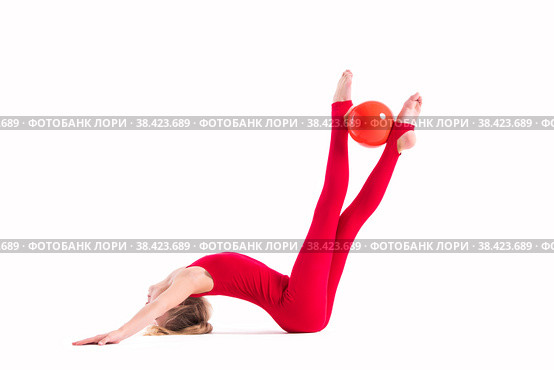 Gymnast girl in a red jumpsuit does an exercise with ball on white background, isolate. Стоковое фото, фотограф Мария Мороз / Фотобанк Лори