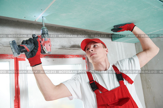 gypsum plasterboard construction work at suspended ceiling. Стоковое фото, фотограф Дмитрий Калиновский / Фотобанк Лори
