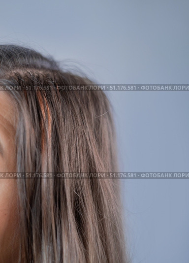 Hair extensions in beauty salon attention to each strand and capsule professional hairstylist at work. Стоковое фото, фотограф Svetlana Golovco / Фотобанк Лори