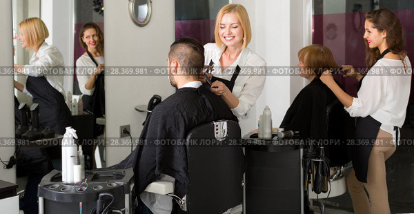 Hairdressers working in barbershop. Стоковое фото, фотограф Яков Филимонов / Фотобанк Лори
