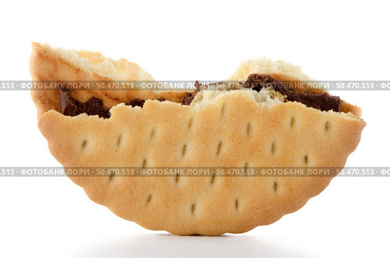 Half sandwich biscuit with chocolate filling on a white background. Стоковое фото, агентство Ingram Publishing / Фотобанк Лори