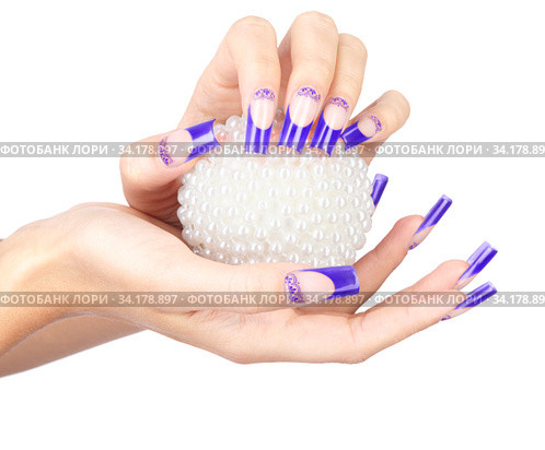 Hands with blue french false acrylic nails manicure holding perl christmas ball. Стоковое фото, фотограф Сергей Пристяжнюк (Serg Zastavkin) / Фотобанк Лори