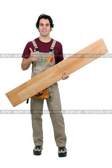 Handyman carrying plank on white background. Стоковое фото, агентство Ingram Publishing / Фотобанк Лори