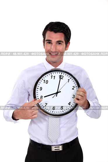 happy businessman pointing at clock. Стоковое фото, агентство Ingram Publishing / Фотобанк Лори