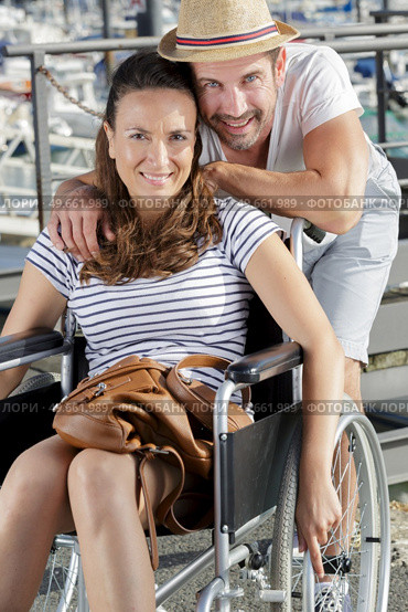 happy woman in wheelchair with husband. Стоковое фото, агентство Ingram Publishing / Фотобанк Лори