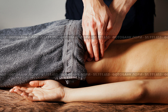 Healing Hands Provide Therapeutic Massage for Sports Injury Recovery. Стоковое фото, фотограф Aleksandr Golubev / Фотобанк Лори