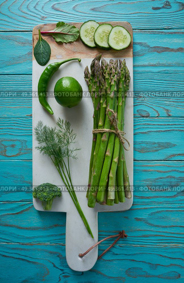 Healthy food vegetables for heart heath on wood. Healthy food vegetables for heart heath on wooden turquoise background. Стоковое фото, агентство Ingram Publishing / Фотобанк Лори