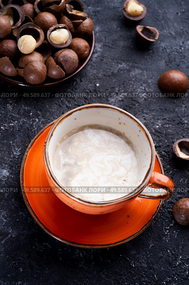 healthy natural  macadamia nuts dessert and coffee served at black table.food  and wellness concept . Стоковое фото, агентство Ingram Publishing / Фотобанк Лори