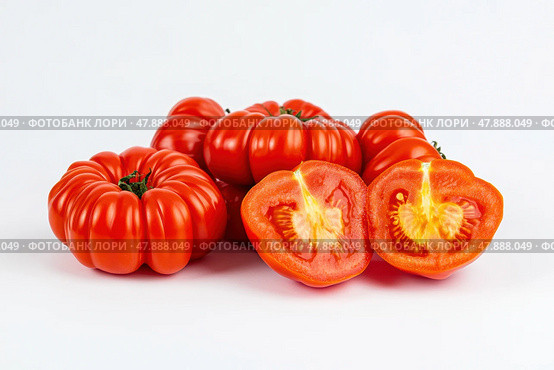 Heirloom tomatoes pile. Heap of Red Tomato isolated with shadow on white background. Set of Fresh red ripe whole tomatoes with half against white backdrop. Vegetables. Full depth of field. Half, whole. Стоковое AI-изображение, AI-художник Марина Демидюк / Фотобанк Лори