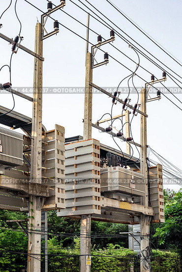High voltage transformers with wires that convert electricity. Power engineering and construction. Стоковое фото, фотограф Коханова Наталья / Фотобанк Лори