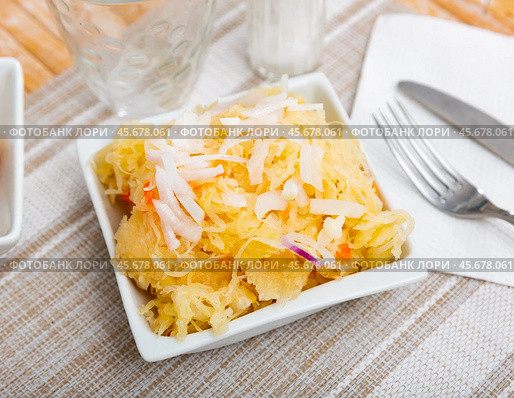 Homemade pickled cabbage on white plate closeup, natural probiotic. Стоковое фото, фотограф Яков Филимонов / Фотобанк Лори