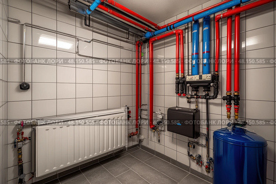 House heating system equipment. Pipelines. Basement mechanical room with condensing water heater, storage tank, plumbing systems. Plumbing service. Pipeline in boiler room. Pipes. Wall installation. Стоковое AI-изображение, AI-художник Марина Демидюк / Фотобанк Лори