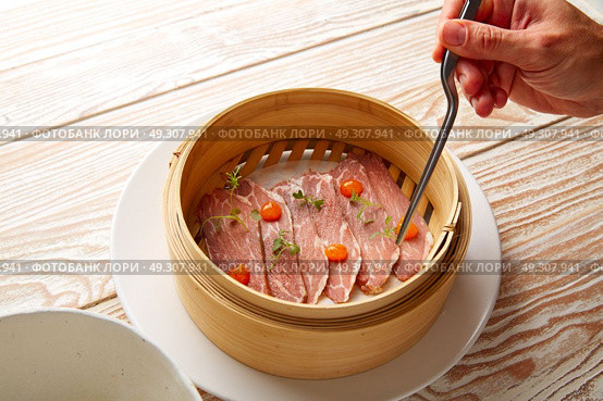 Iberian pork ham with XO sauce recipe chef hand. Стоковое фото, агентство Ingram Publishing / Фотобанк Лори