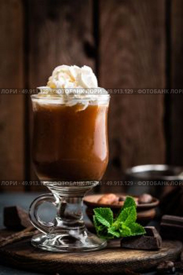 Iced cocoa drink with whipped cream, cold chocolate beverage, coffee frappe on dark background. Стоковое фото, агентство Ingram Publishing / Фотобанк Лори