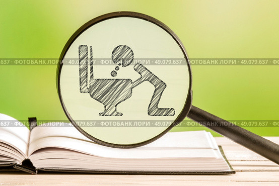 Illness analysis with a pencil drawing of a sick person in a magnifying glass. Стоковое фото, агентство Ingram Publishing / Фотобанк Лори