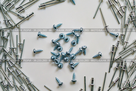 Image of scattered rivets and screws. Стоковое фото, фотограф Siarhei Starastau / Фотобанк Лори