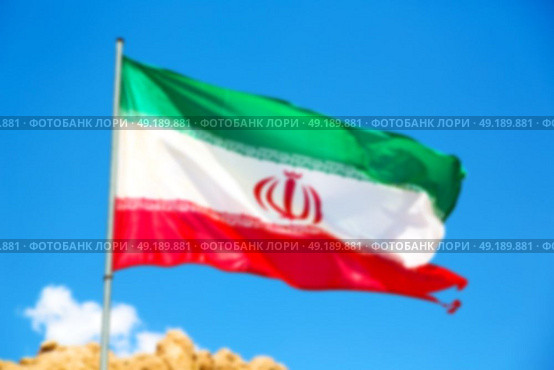 in iran blur  iranian waving flag  the blue sky and wind. Стоковое фото, агентство Ingram Publishing / Фотобанк Лори