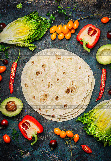 Ingredients for tacos or burrito making.  Fresh organic vegetables and tortillas on rustic background, top view, place for text. Стоковое фото, агентство Ingram Publishing / Фотобанк Лори