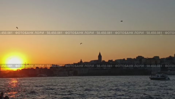 Istanbul, Turkey – June 8, 2025: Beyoglu district with the famous Galata Tower. Iconic Istanbul city view with ships and seagulls at sunset. Редакционное видео, видеограф Оксана Чаюн / Фотобанк Лори