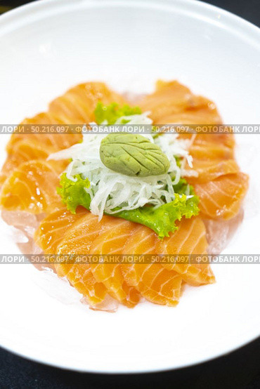 Japanese fresh salmon sashimi or Japanese gourmet and delicacy sashimi with raw sliced fish. Стоковое фото, агентство Ingram Publishing / Фотобанк Лори