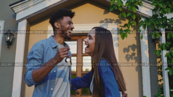 Joyful Moments Shared: A Couple Celebrating Their New Chapter with Laughter and Keys in Hand, Reflecting Happiness and Connection in a Beautiful Setting. Стоковое AI-видео, аниматор Владимир Федоров / Фотобанк Лори