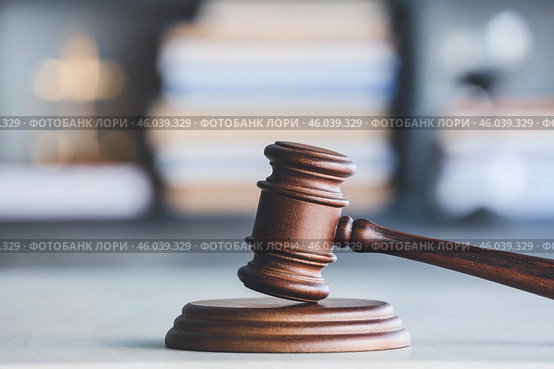 Judge's gavel on table in office. Стоковое фото, фотограф Pixel_shot / Фотобанк Лори