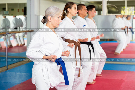 Karate or taekwondo training - athletes in kimono stand in fighting stance. Стоковое фото, фотограф Яков Филимонов / Фотобанк Лори