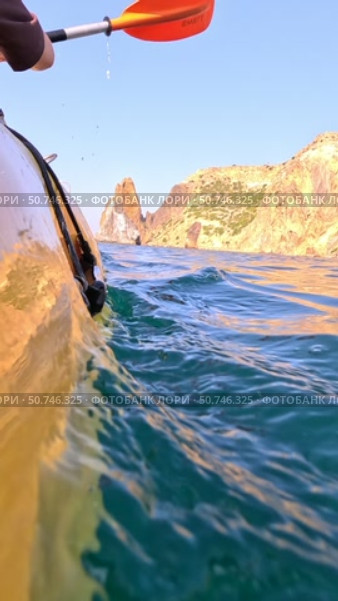 Kayak Paddle Water: Kayak paddle dips underwater, showing motion in water recreation, hobby activity. Стоковое видео, видеограф svetograph / Фотобанк Лори